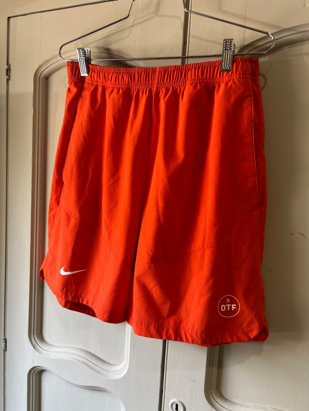 Nike Men's Athletic Shorts in Vibrant Orange with Swoosh